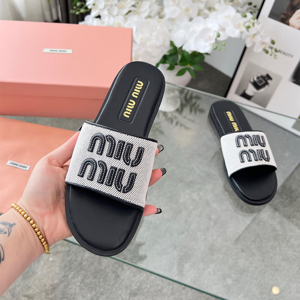 MiuMiu Canvas and leather slides